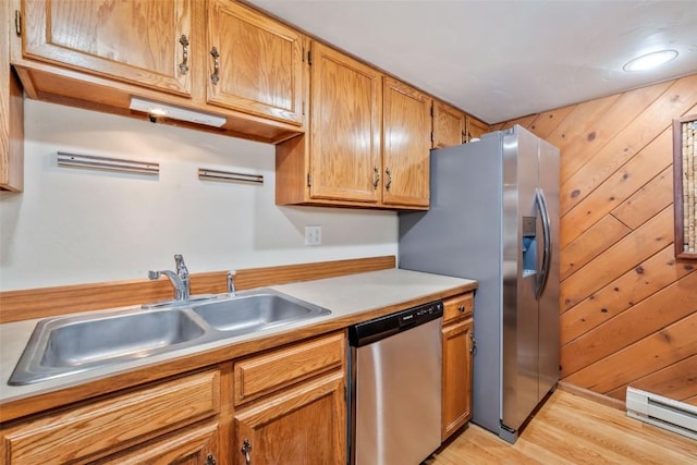 2915 Chinook Ln Unit B22, Steamboat Springs, CO 80487 - kitchen featuring stainless steel appliances, a baseboard radiator, a sink, light countertops, and light wood-type flooring