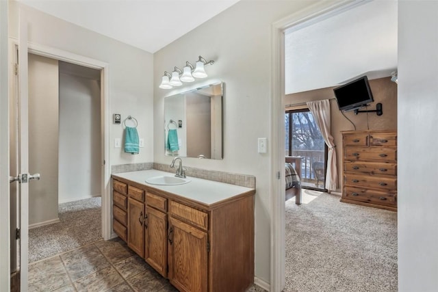 bathroom with baseboards and vanity
