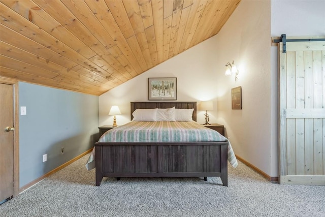 bedroom with a barn door, vaulted ceiling, wood ceiling, and carpet