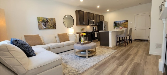 9279 Merino Ct # B, Littleton, CO 80125 - living room with light wood finished floors and recessed lighting