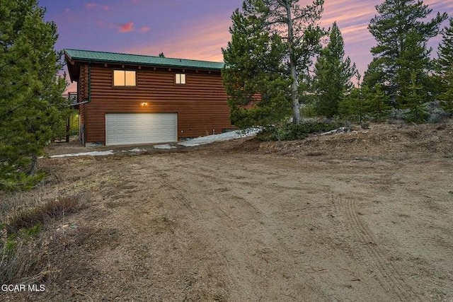 90 Gcr 864, Tabernash, CO 80478 - view of property exterior with a garage, driveway, and metal roof