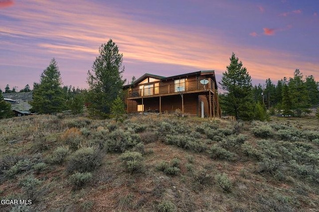 90 Gcr 864, Tabernash, CO 80478 - back of house at dusk with a wooden deck
