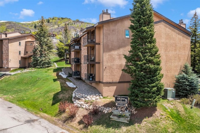 view of building exterior with a mountain view