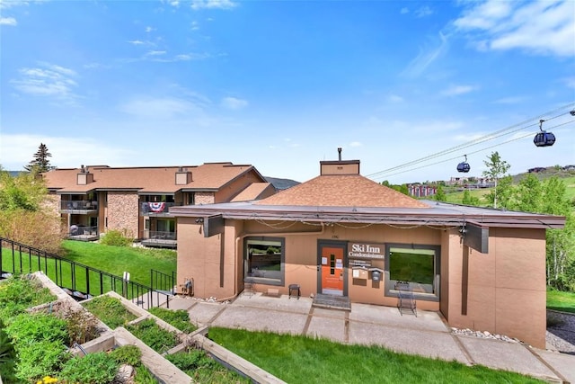 2350 Ski Trail Ln Unit 136, Steamboat Springs, CO 80487 - rear view of house featuring a patio area and stucco siding
