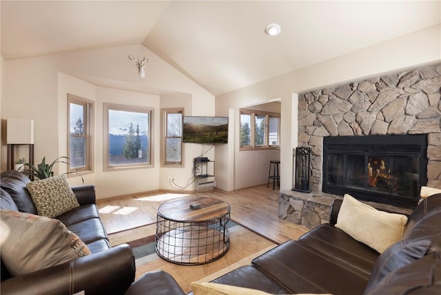 1120 Baldy Rd, Breckenridge, CO 80424 - living room featuring vaulted ceiling, a fireplace, and wood finished floors