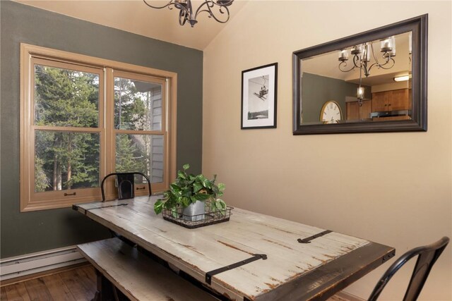 1120 Baldy Rd, Breckenridge, CO 80424 - dining room with a chandelier, vaulted ceiling, a baseboard radiator, and wood finished floors