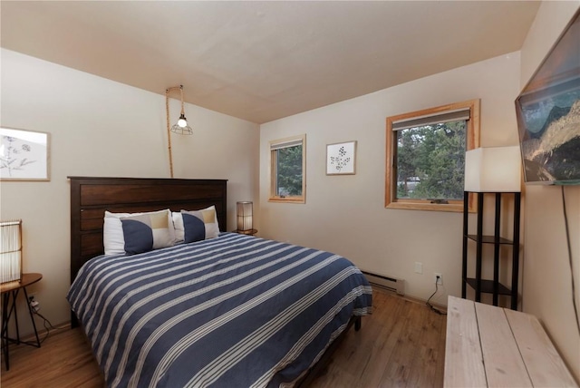1120 Baldy Rd, Breckenridge, CO 80424 - bedroom featuring wood finished floors and a baseboard radiator