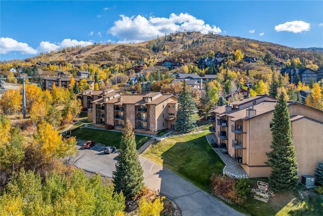 2350 Ski Trail Ln Unit 112, Steamboat Springs, CO 80487 - aerial overview of property's location with a mountainous background and nearby suburban area