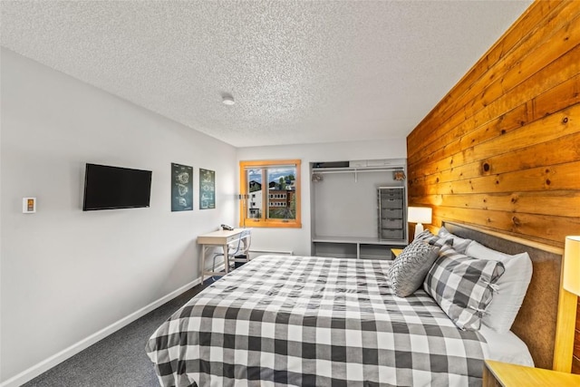 2350 Ski Trail Ln Unit 112, Steamboat Springs, CO 80487 - carpeted bedroom featuring a textured ceiling and baseboards
