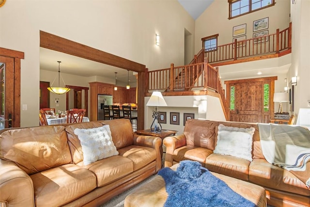 366 Moonstone Rd, Breckenridge, CO 80424 - living room featuring high vaulted ceiling and stairs