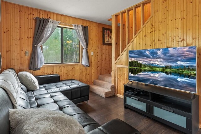 465 Mount Guyot Cir, Jefferson, CO 80456 - living area featuring stairway, wooden walls, and wood finished floors
