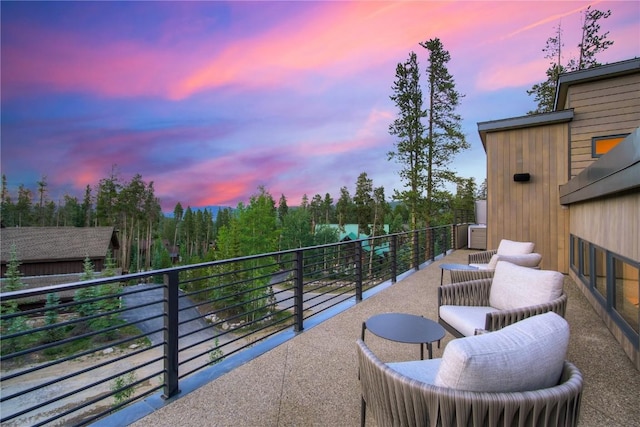 view of balcony at dusk