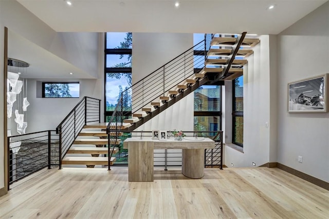 stairs featuring hardwood / wood-style flooring