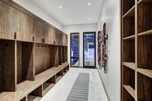 mudroom with light tile patterned floors