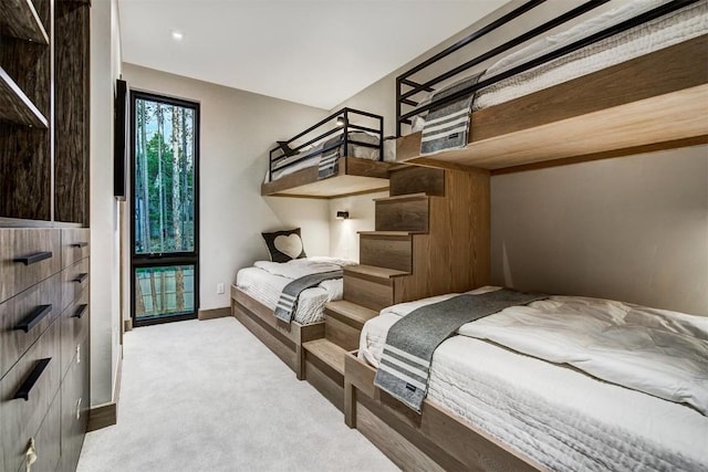 bedroom featuring light colored carpet