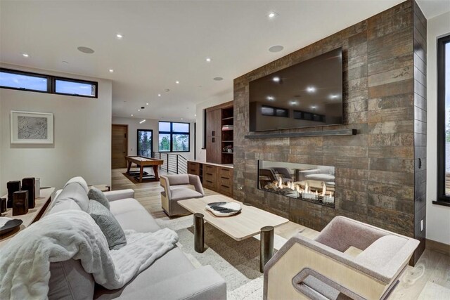 living room with a fireplace and hardwood / wood-style flooring