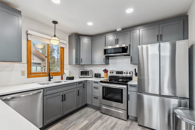 1009 American Way, Breckenridge, CO 80424 - kitchen with stainless steel appliances, gray cabinets, a sink, decorative backsplash, and recessed lighting