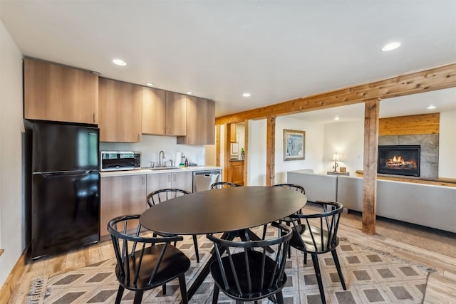 1009 American Way, Breckenridge, CO 80424 - dining space with recessed lighting, light wood finished floors, and a large fireplace