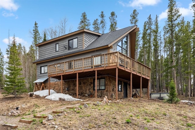 1009 American Way, Breckenridge, CO 80424 - back of house featuring a wooden deck and stone siding