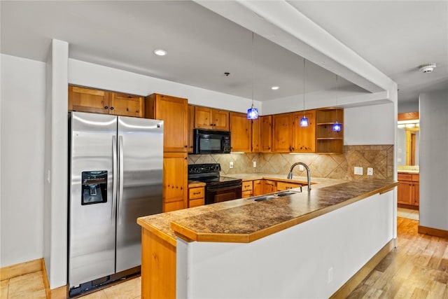 435 Ore House Plz Unit 202, Steamboat Springs, CO 80487 - kitchen with black appliances, a sink, open shelves, a peninsula, and decorative backsplash