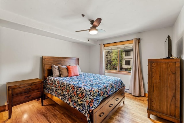 435 Ore House Plz Unit 202, Steamboat Springs, CO 80487 - bedroom featuring light wood finished floors, ceiling fan, and baseboard heating