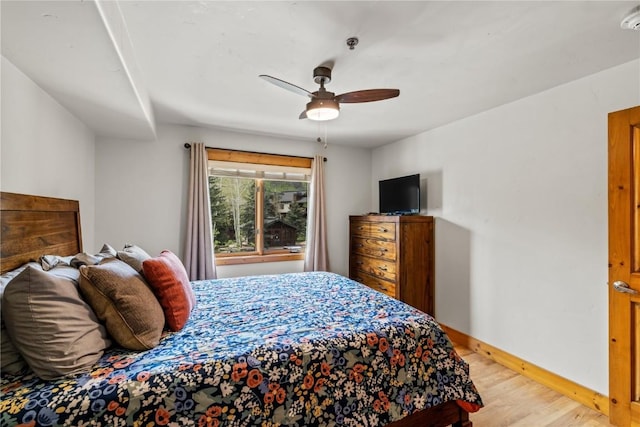 435 Ore House Plz Unit 202, Steamboat Springs, CO 80487 - bedroom featuring light wood-style floors, baseboards, and ceiling fan