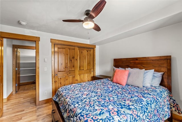 435 Ore House Plz Unit 202, Steamboat Springs, CO 80487 - bedroom featuring light wood-style floors, baseboards, a closet, and a ceiling fan