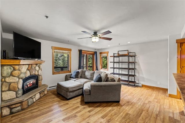 435 Ore House Plz Unit 202, Steamboat Springs, CO 80487 - living room featuring light wood-style floors, a baseboard heating unit, a ceiling fan, recessed lighting, and baseboards