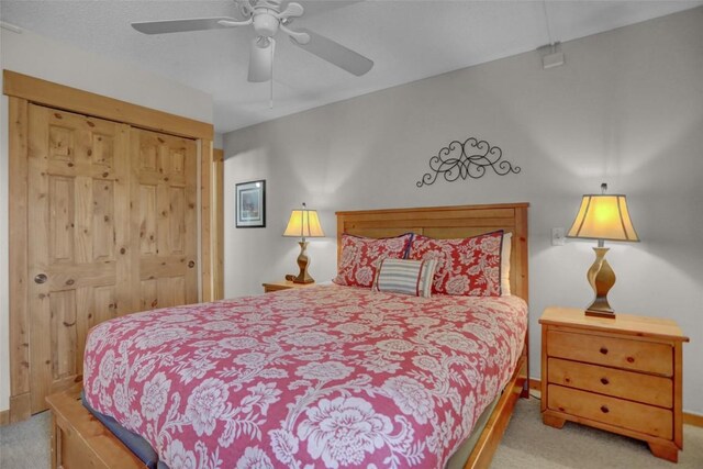 1805 River Queen Ln Unit 201, Steamboat Springs, CO 80487 - carpeted bedroom with a ceiling fan, baseboards, and a closet