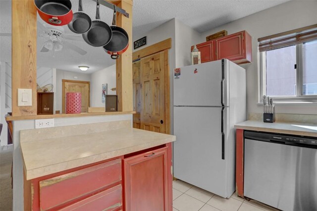 1805 River Queen Ln Unit 201, Steamboat Springs, CO 80487 - kitchen with dishwasher, a ceiling fan, light countertops, and freestanding refrigerator
