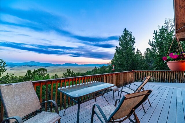 1023 Raven Way, Como, CO 80432 - deck at dusk featuring a mountain view