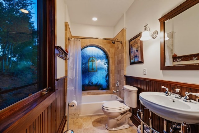 1023 Raven Way, Como, CO 80432 - full bathroom featuring tile patterned floors, a wainscoted wall, a sink, toilet, and shower / bath combination with curtain