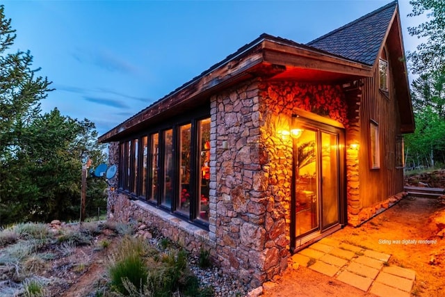 1023 Raven Way, Como, CO 80432 - view of home's exterior with stone siding and a shingled roof
