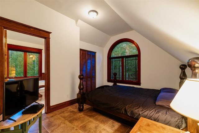 1023 Raven Way, Como, CO 80432 - bedroom featuring vaulted ceiling, tile patterned floors, and baseboards