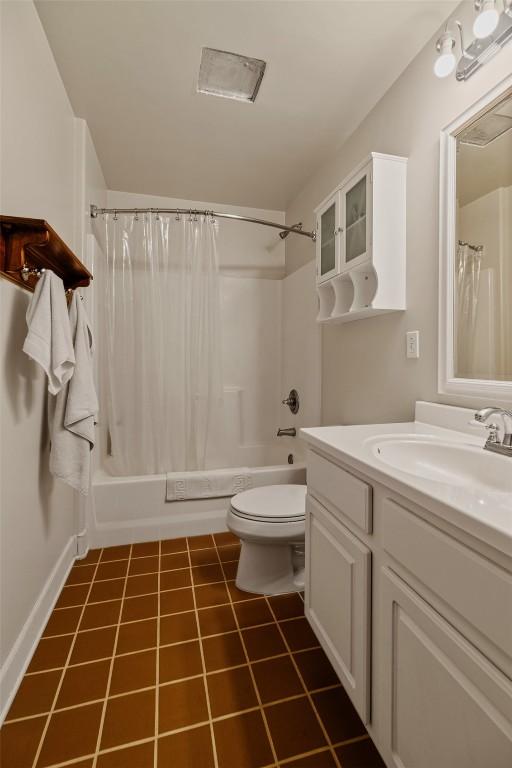 1023 Raven Way, Como, CO 80432 - bathroom with shower / bath combo with shower curtain, toilet, vanity, and tile patterned floors