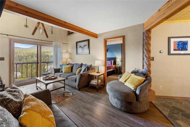 9490 Ryan Gulch Rd Unit 94202, Silverthorne, CO 80498 - living room featuring beam ceiling and wood finished floors