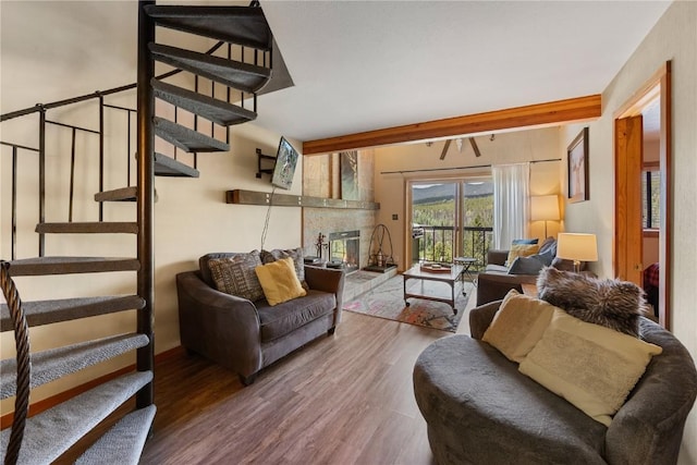 9490 Ryan Gulch Rd Unit 94202, Silverthorne, CO 80498 - living area with stairs, wood finished floors, and a glass covered fireplace