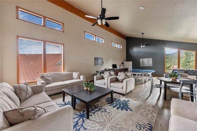 9490 Ryan Gulch Rd Unit 94202, Silverthorne, CO 80498 - living area featuring ceiling fan, light wood-type flooring, and a towering ceiling