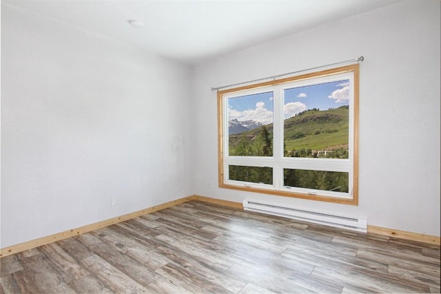 338 Deer Path Rd, Dillon, CO 80435 - unfurnished room featuring baseboard heating and wood finished floors