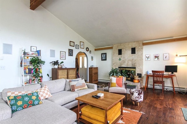338 Deer Path Rd, Dillon, CO 80435 - living room featuring arched walkways, baseboard heating, a tiled fireplace, hardwood / wood-style flooring, and high vaulted ceiling