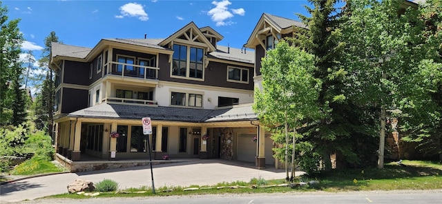 655 Four Oclock Rd Unit 209, Breckenridge, CO 80424 - view of property featuring a garage and driveway