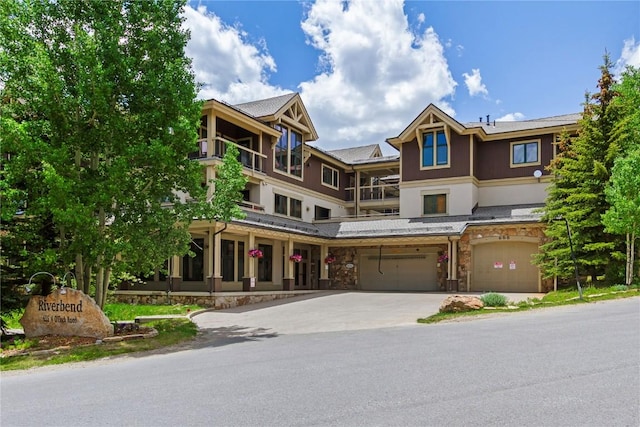 655 Four Oclock Rd Unit 209, Breckenridge, CO 80424 - multi unit property with stone siding, a garage, driveway, and stucco siding