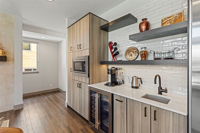kitchen with wine cooler, a sink, stainless steel microwave, modern cabinets, and open shelves