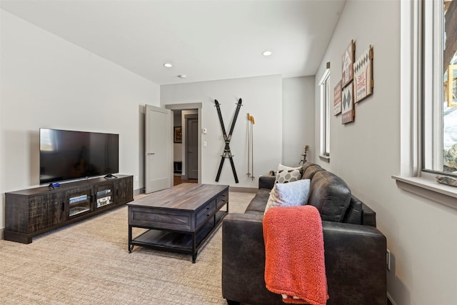 living area featuring baseboards and recessed lighting