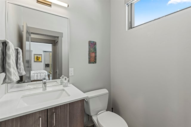 bathroom with toilet and vanity