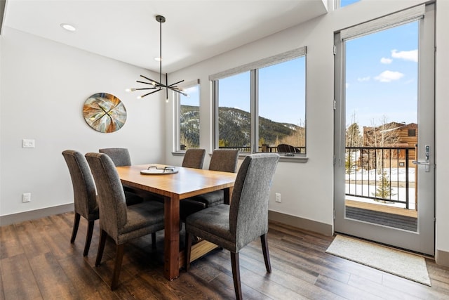 dining space featuring recessed lighting, wood finished floors, and plenty of natural light