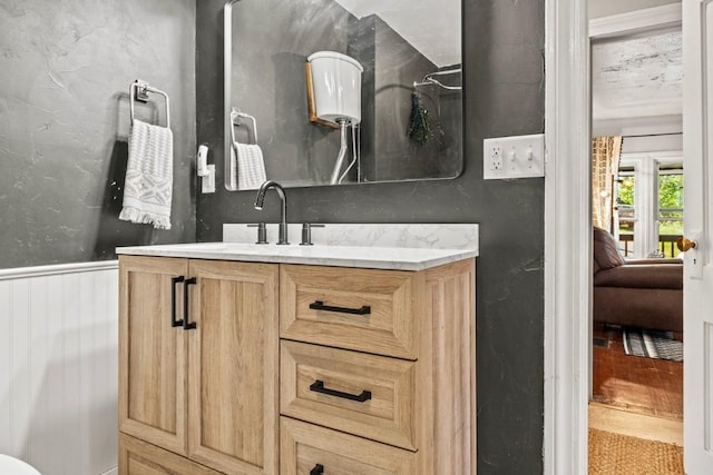 200 N Grant Ave, Oak Creek, CO 80467 - bathroom with vanity and a wainscoted wall