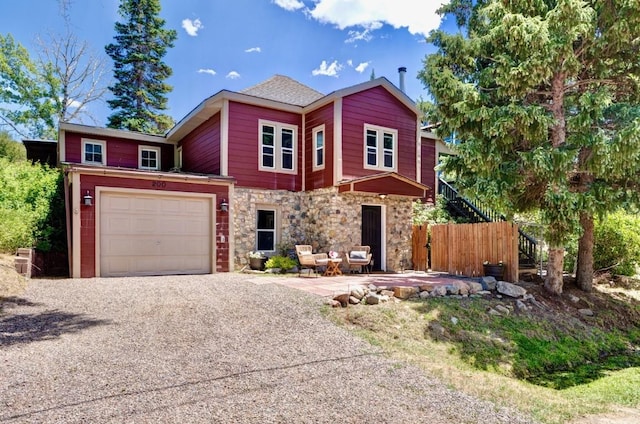 200 N Grant Ave, Oak Creek, CO 80467 - view of front of house featuring stone siding and gravel driveway