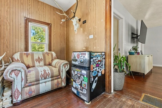 200 N Grant Ave, Oak Creek, CO 80467 - sitting room featuring hardwood / wood-style floors, wood walls, and vaulted ceiling