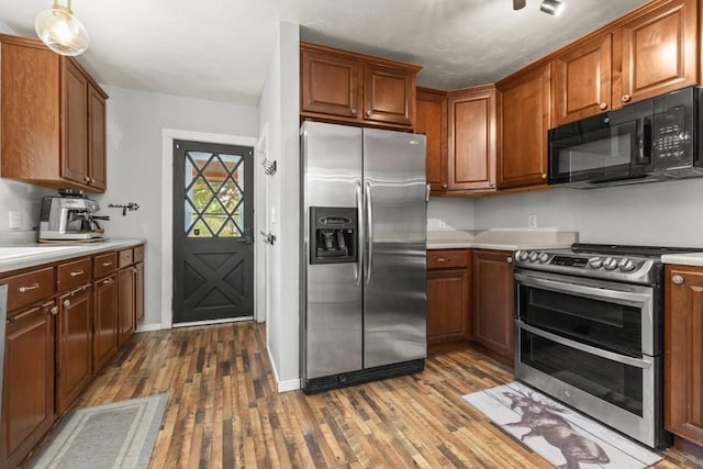 200 N Grant Ave, Oak Creek, CO 80467 - kitchen featuring stainless steel appliances, hardwood / wood-style floors, and light countertops